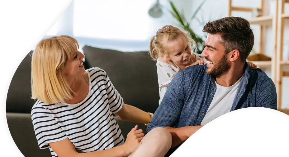 Image: Mother and father playing with daughter